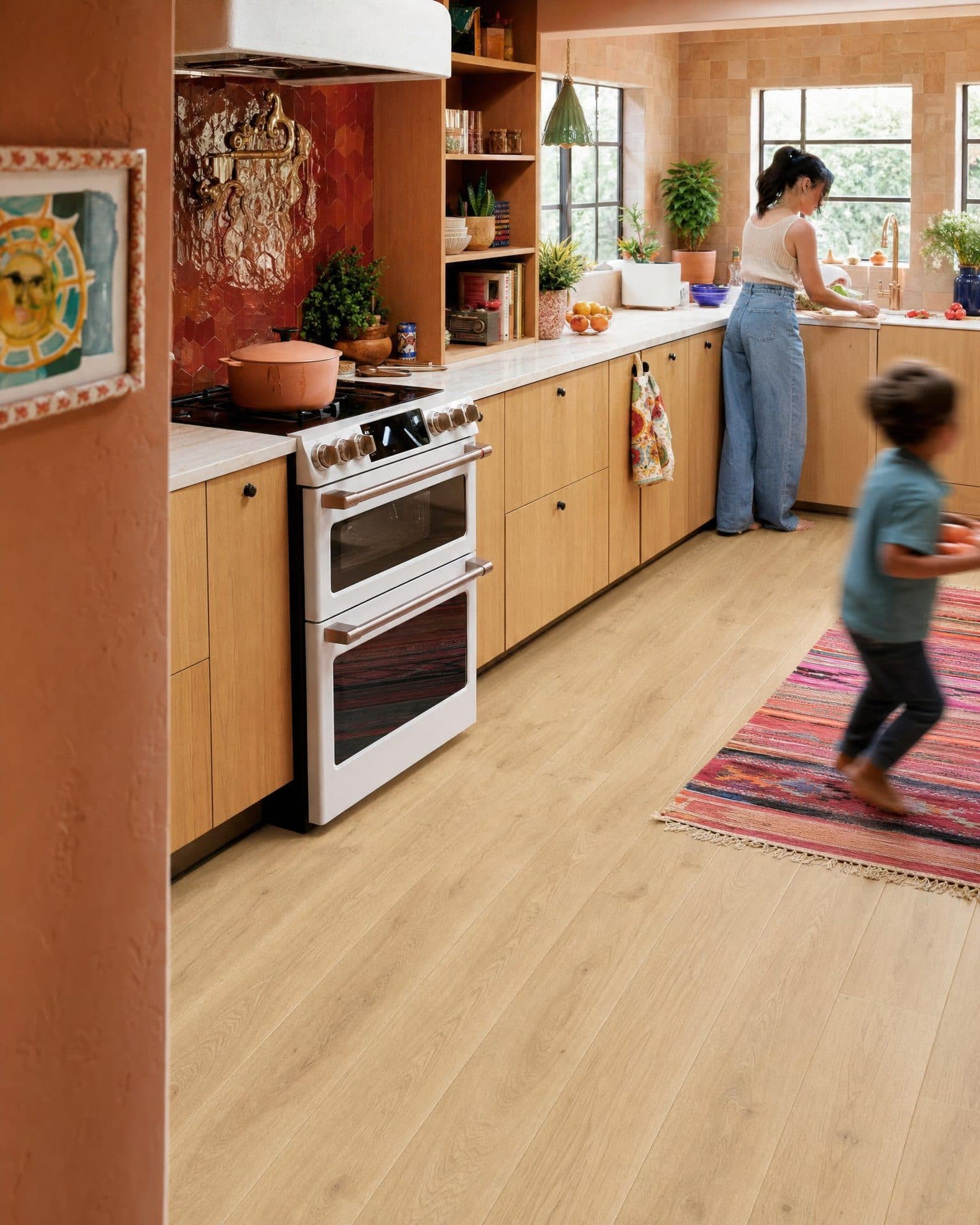 A family kitchen with warm wide-plank flooring